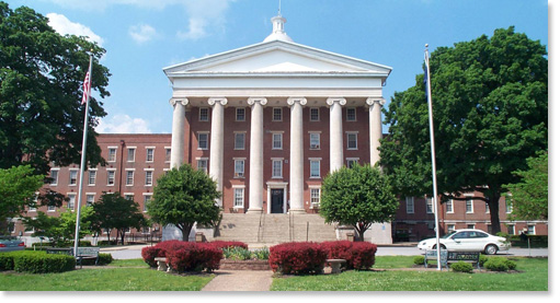 Image of the front of Western State Hospital showing a brick building with six columns.